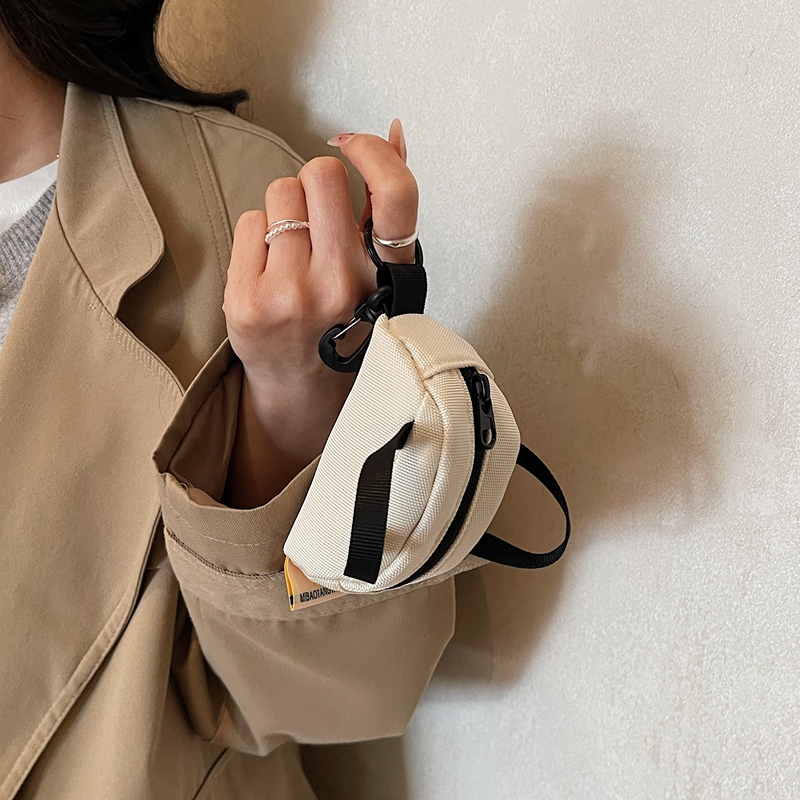 حقائب صغيرة لطيفة لسماعات الأذ - مراجعة Coin Purse Women وسعره